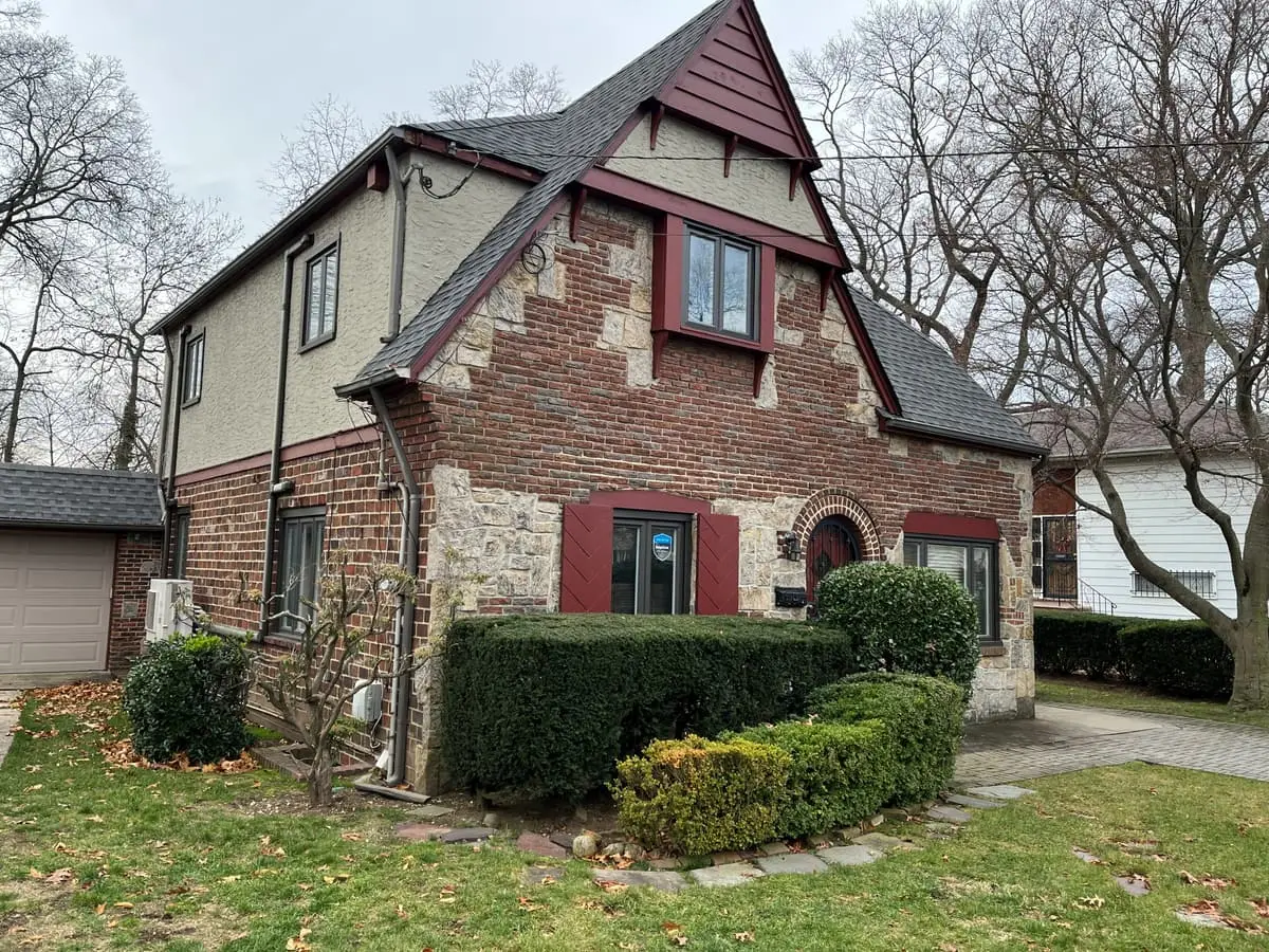 Selling a rental property in Hempstead: brick and stone Tudor with a steep front gable